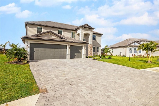 view of front facade with a garage and a front yard