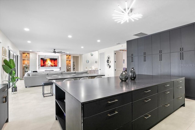 kitchen with a large island and ceiling fan