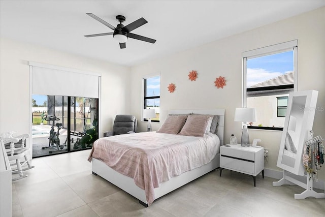 bedroom featuring ceiling fan and access to exterior