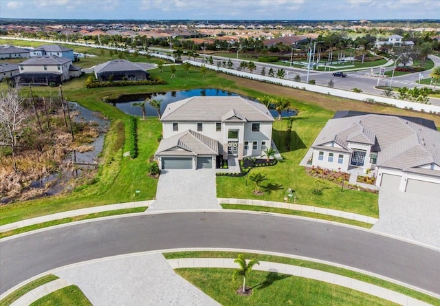 aerial view with a water view and a residential view