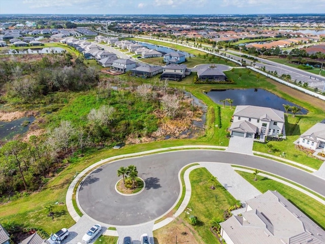 birds eye view of property featuring a residential view and a water view