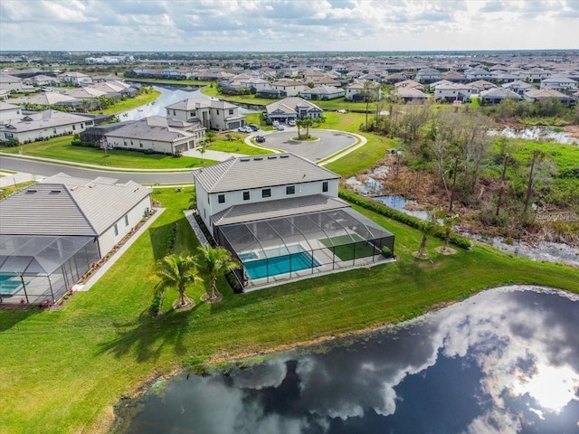 bird's eye view featuring a water view and a residential view