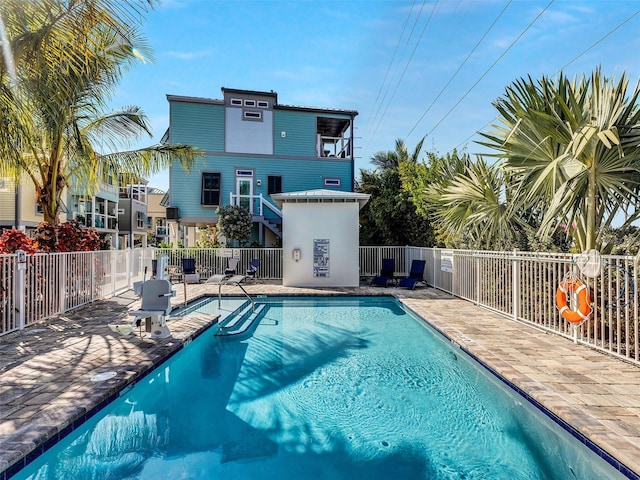 view of swimming pool with a patio