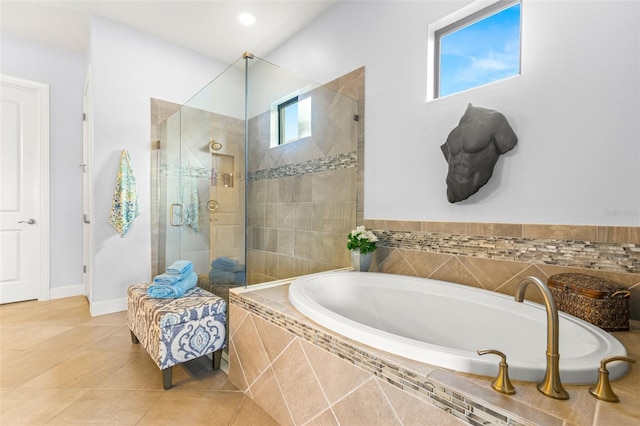 bathroom with tile patterned floors and plus walk in shower