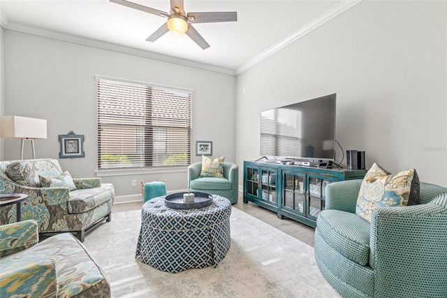 living room with ceiling fan, light hardwood / wood-style flooring, and ornamental molding