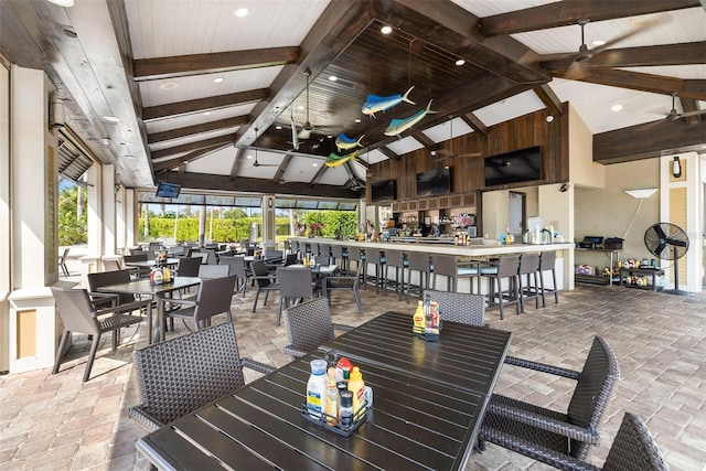 view of patio / terrace with ceiling fan and exterior bar