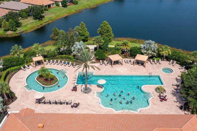 view of swimming pool featuring a water view