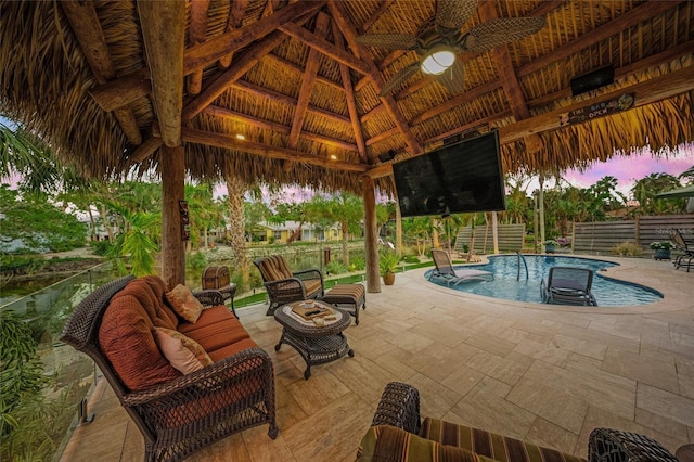 view of pool featuring a gazebo, ceiling fan, a patio area, and an outdoor living space