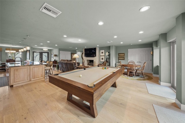 game room with sink, light hardwood / wood-style flooring, and billiards