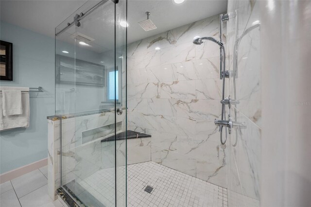 bathroom featuring tile patterned floors and a shower with door