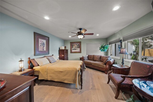 bedroom featuring ceiling fan and light hardwood / wood-style floors