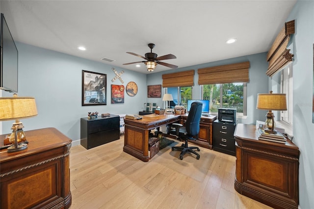 office space featuring ceiling fan and light hardwood / wood-style floors