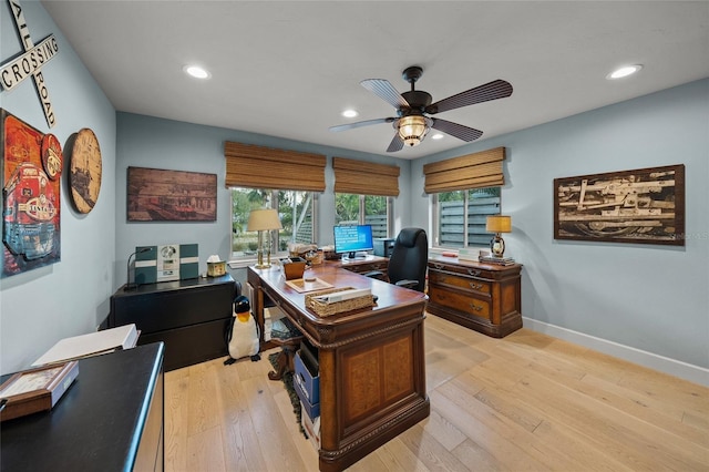 home office featuring ceiling fan and light hardwood / wood-style flooring