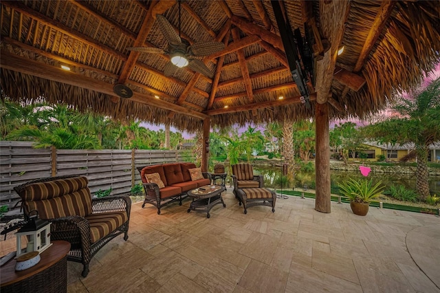 view of patio featuring outdoor lounge area, a gazebo, and ceiling fan