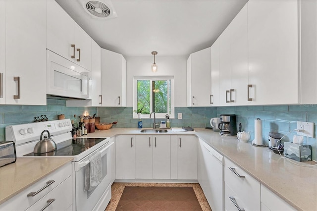 kitchen with white cabinetry, sink, backsplash, decorative light fixtures, and white appliances