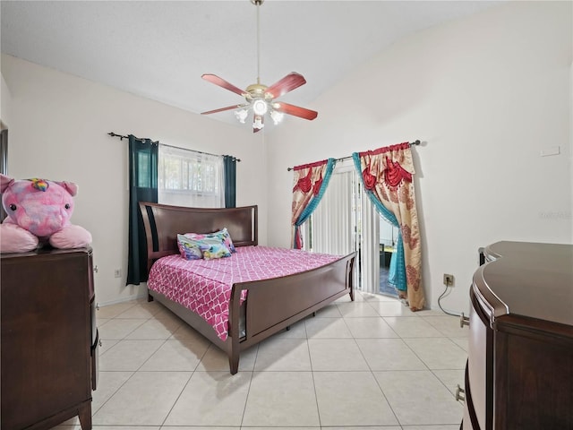 bedroom with ceiling fan, light tile patterned floors, and lofted ceiling