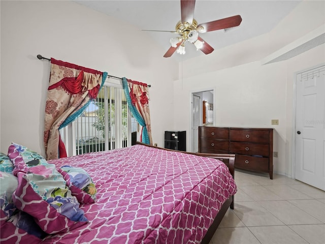 tiled bedroom with ceiling fan and access to exterior