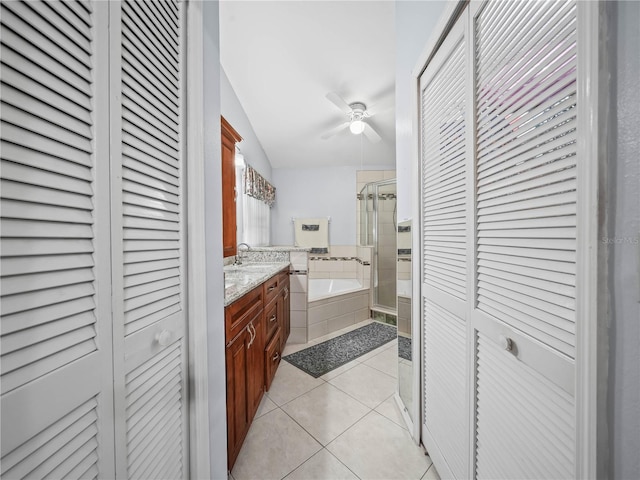 bathroom with tile patterned flooring, vanity, and independent shower and bath