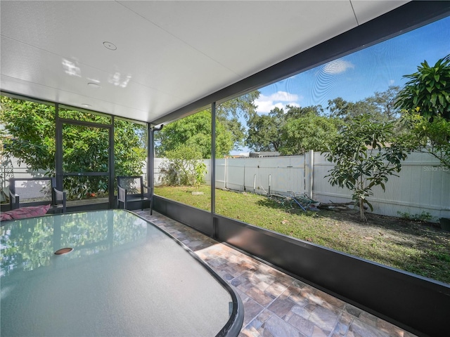 unfurnished sunroom featuring a wealth of natural light