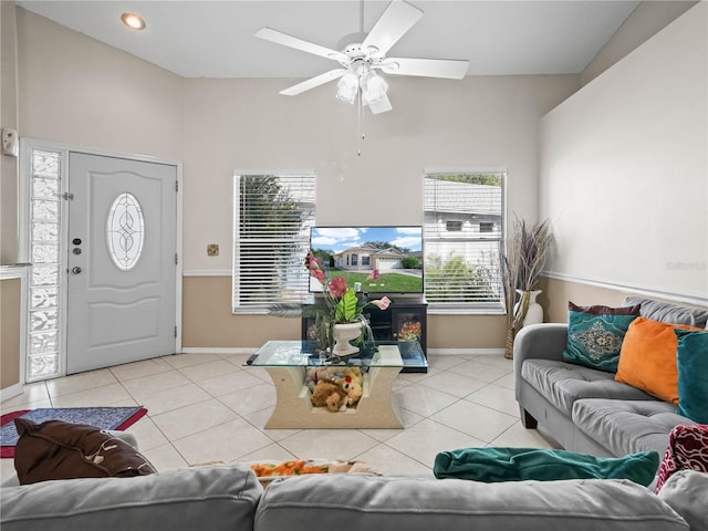 living room featuring light tile patterned floors and ceiling fan