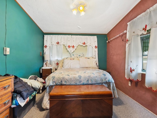 carpeted bedroom featuring crown molding