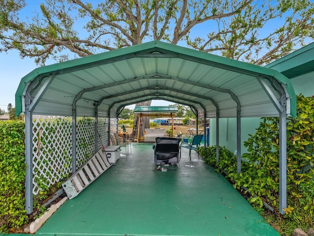 view of vehicle parking with a carport