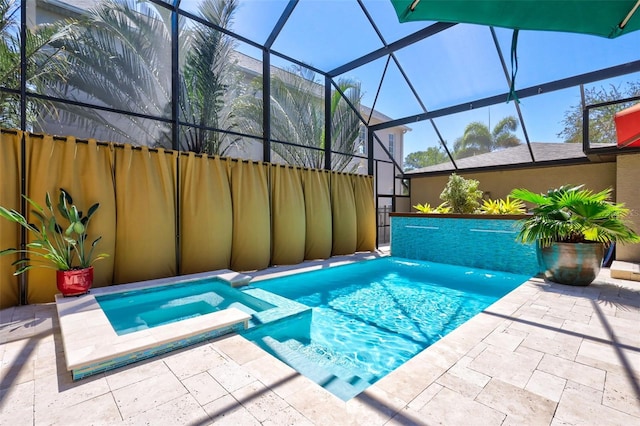 view of pool with glass enclosure, a patio area, and an in ground hot tub