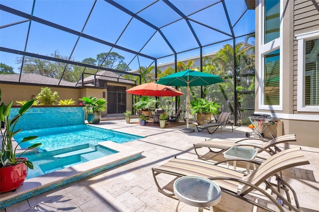 view of swimming pool with a lanai, a patio area, and an in ground hot tub