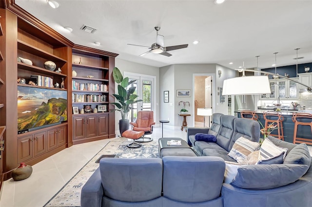 tiled living room with ceiling fan