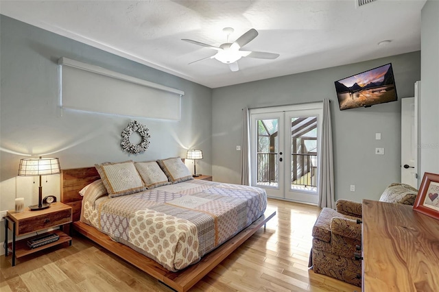 bedroom with french doors, light wood-type flooring, access to outside, and ceiling fan