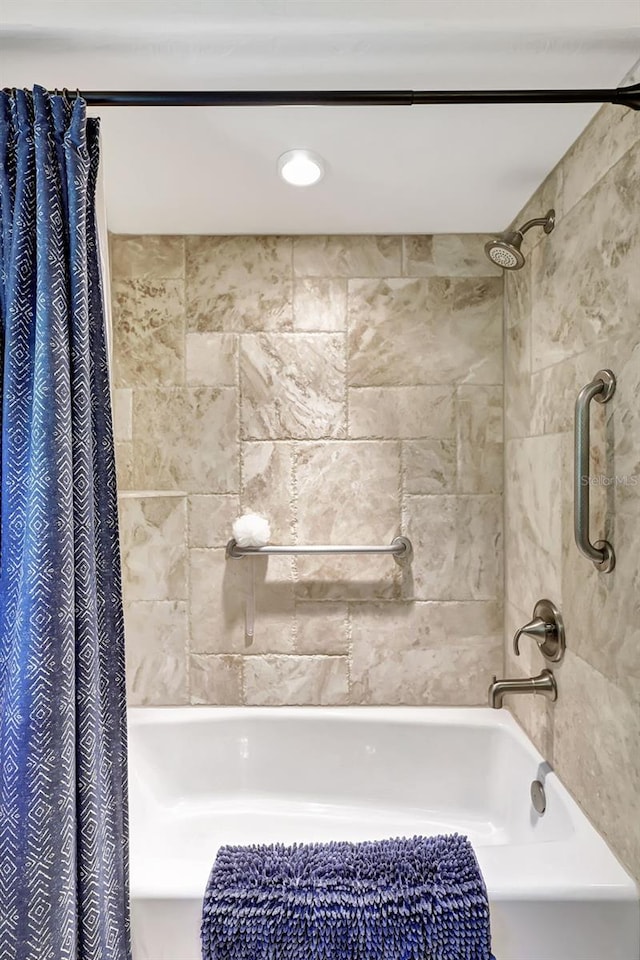 bathroom with shower / bath combination with curtain