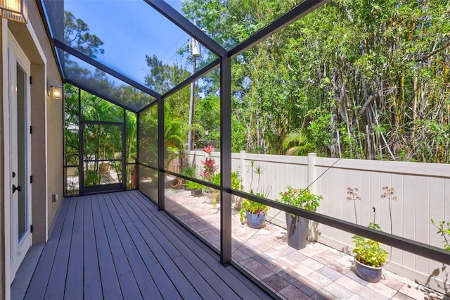 unfurnished sunroom with a wealth of natural light