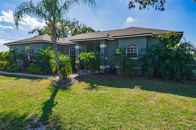 ranch-style house with a front lawn