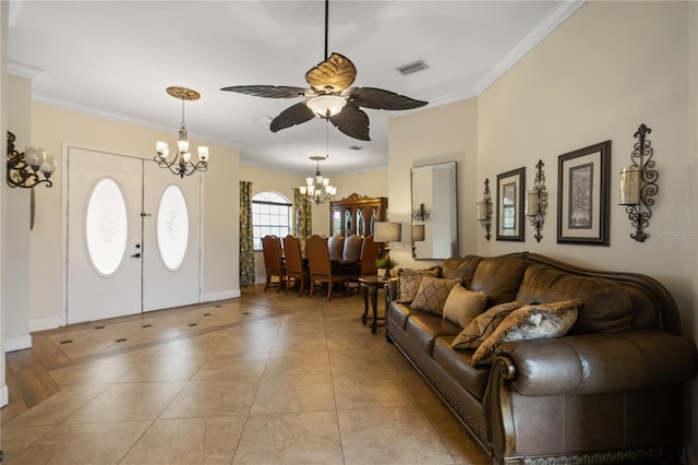 tiled living room with ceiling fan with notable chandelier, crown molding, and french doors