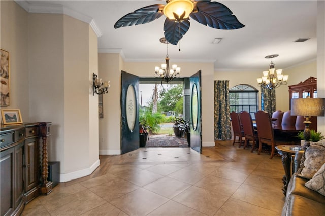 tiled entrance foyer featuring crown molding and a notable chandelier