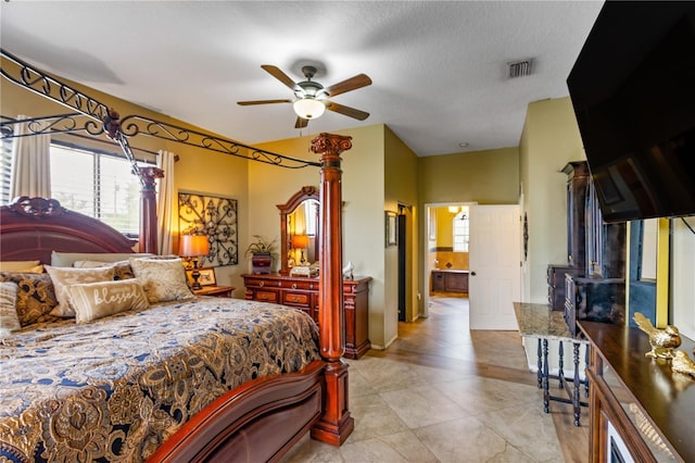 bedroom featuring ceiling fan and a textured ceiling