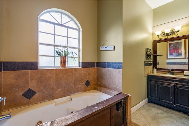 bathroom featuring tile patterned floors, a bathtub, and vanity