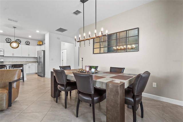 dining space featuring light tile patterned flooring