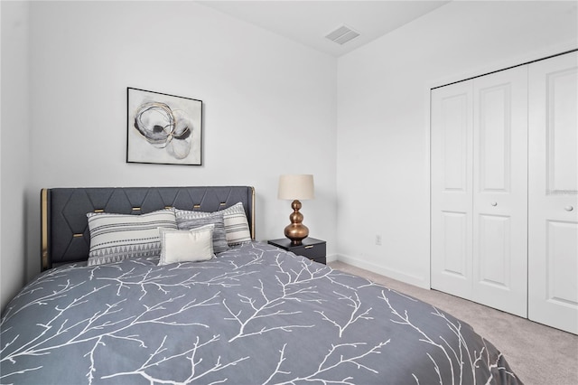 carpeted bedroom featuring a closet