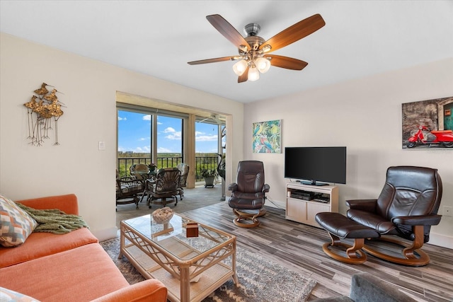 living room with hardwood / wood-style floors and ceiling fan