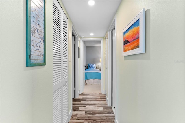 corridor with light hardwood / wood-style flooring