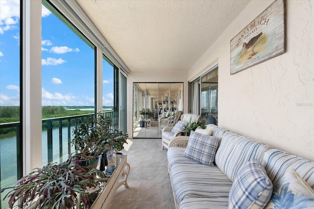 sunroom with a water view