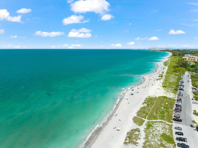 aerial view with a water view and a view of the beach