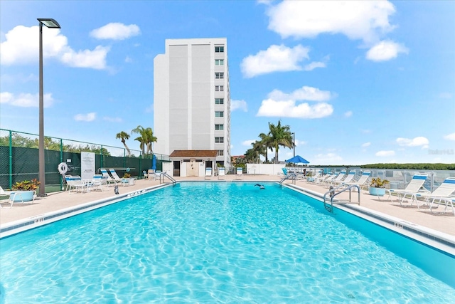 view of swimming pool with a patio area