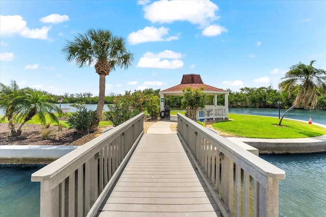 view of community featuring a gazebo, a lawn, and a water view