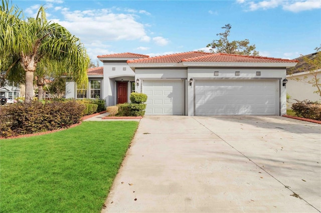 mediterranean / spanish-style home with a front yard and a garage