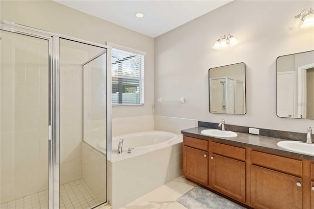 bathroom featuring vanity and plus walk in shower