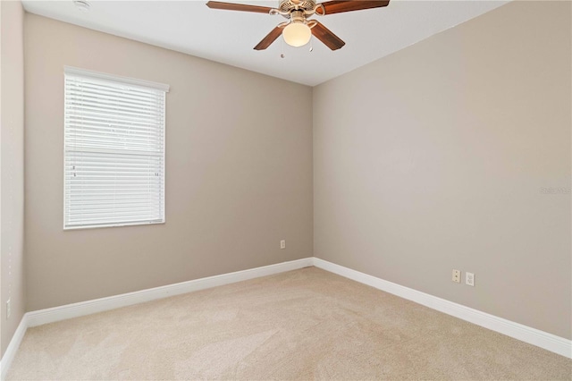 unfurnished room with light carpet and ceiling fan