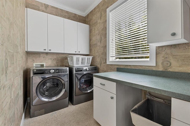 washroom with cabinets, separate washer and dryer, and ornamental molding