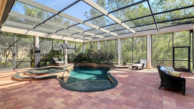 view of pool featuring an in ground hot tub, a patio area, and a lanai